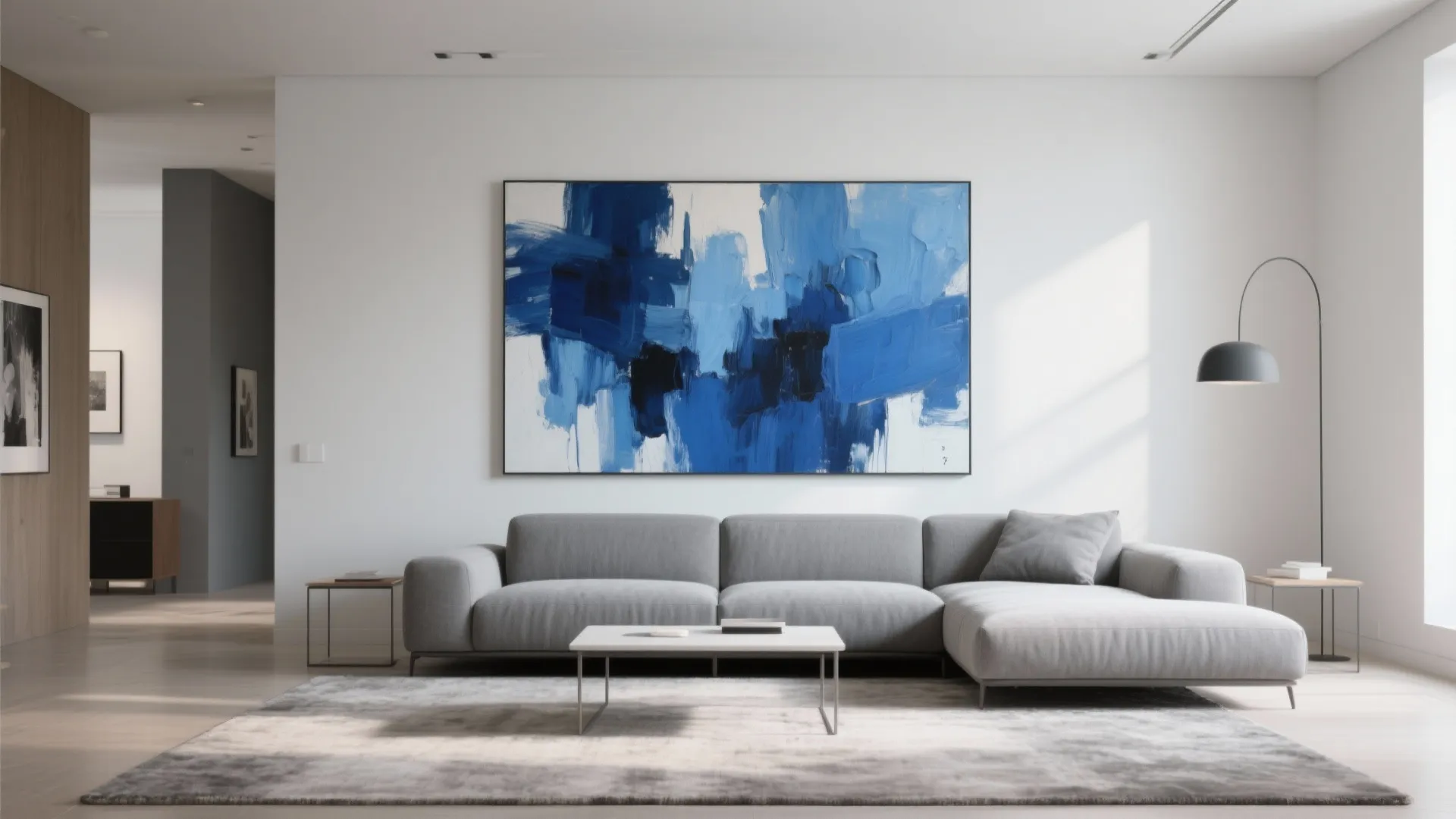 Blue abstract painting above grey couch in modern living room