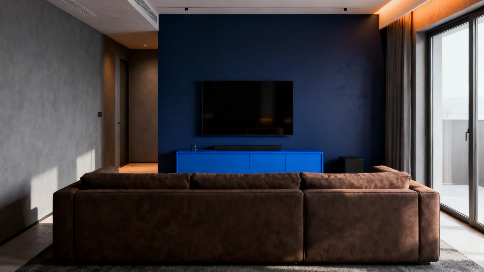 Small living room with a muted navy blue accent wall and a blue media cabinet