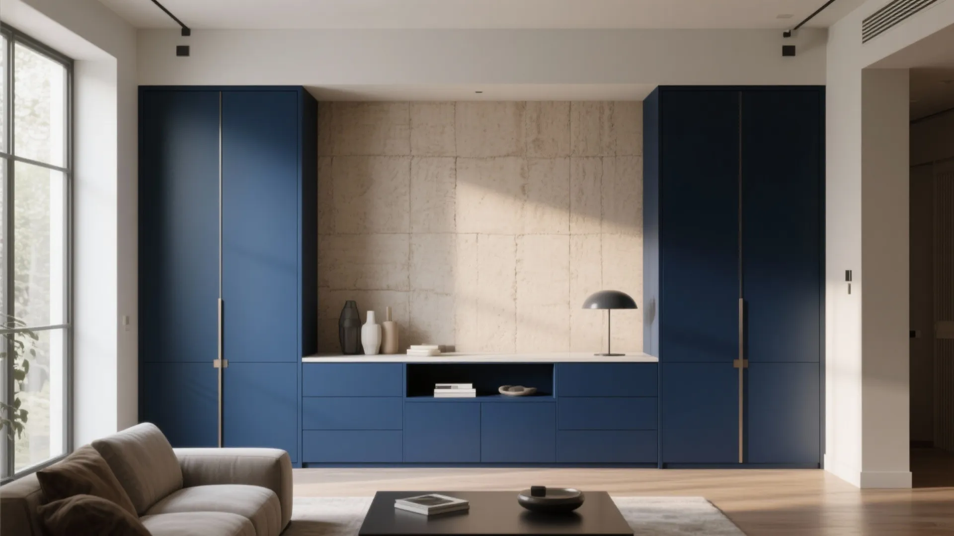 Modern blue cabinet set against a textured beige wall panel with a small black table light
