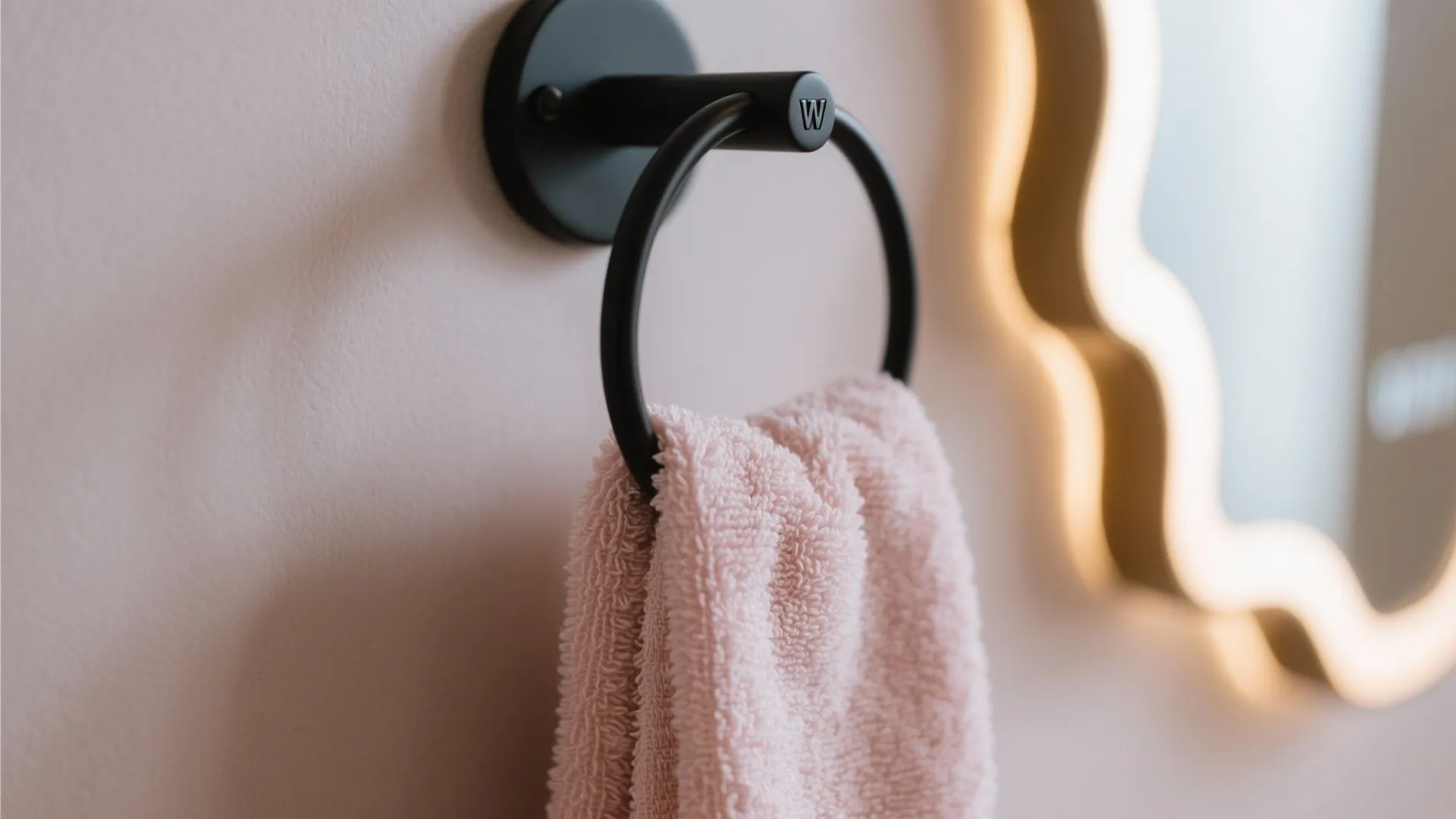 Blush Accents: Towels, Rugs, and a Statement Mirror