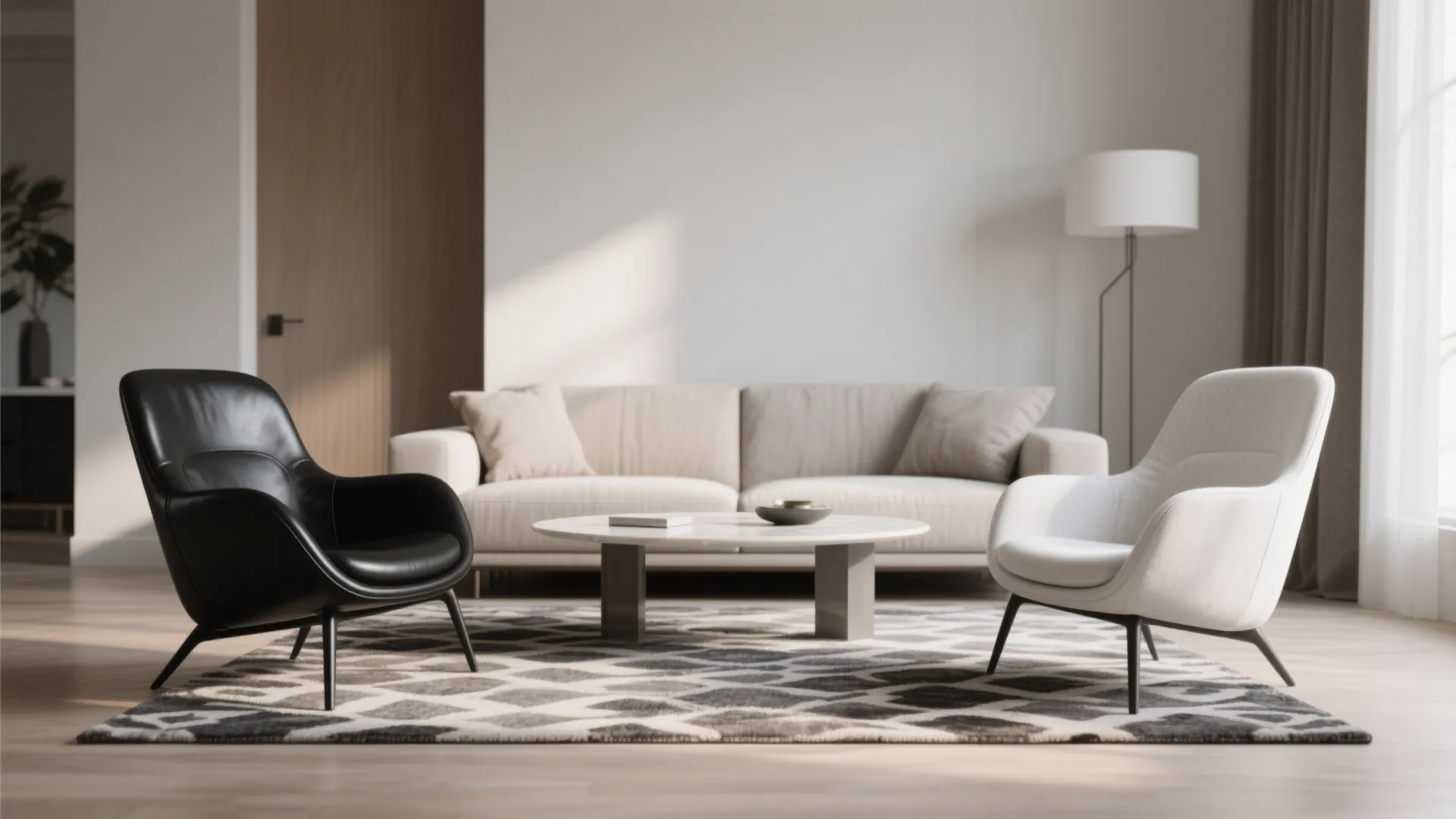 Living room featuring black and white chairs on patterned rug with beige sofa and lamp