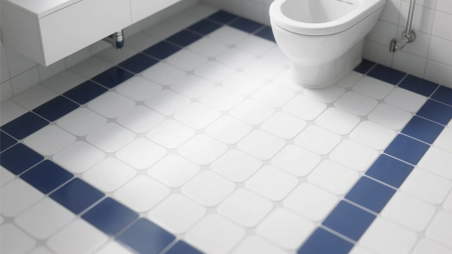 Modern bathroom floor with white square tiles and blue tile border next to white toilet
