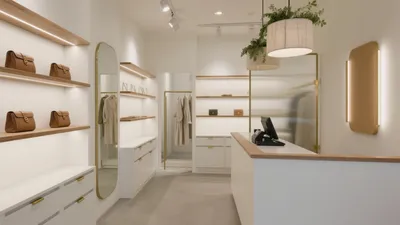 Modern Boutique Store Interior with Warm Wood & Gold Accent