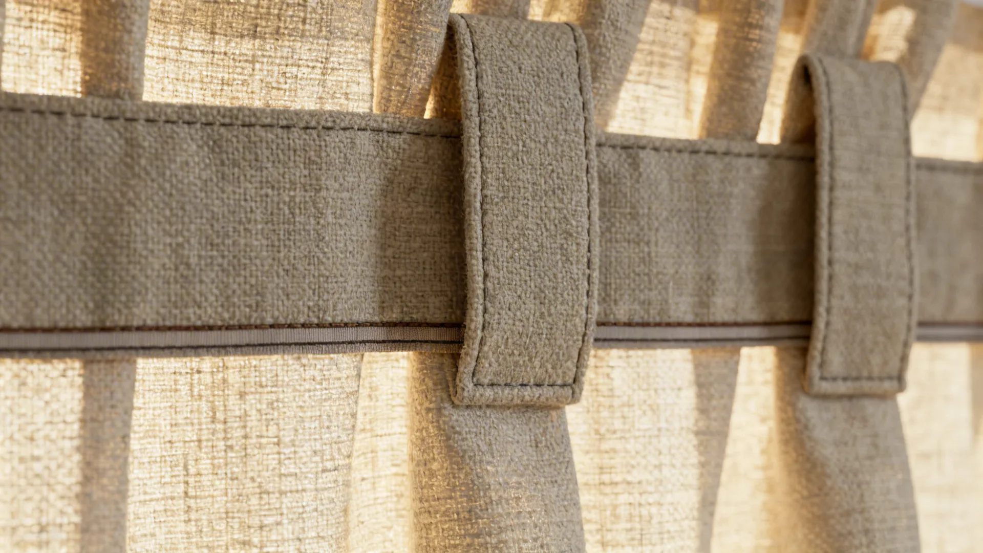 Close-up of box pleat and tailored tab on short linen-blend curtain with neat hem