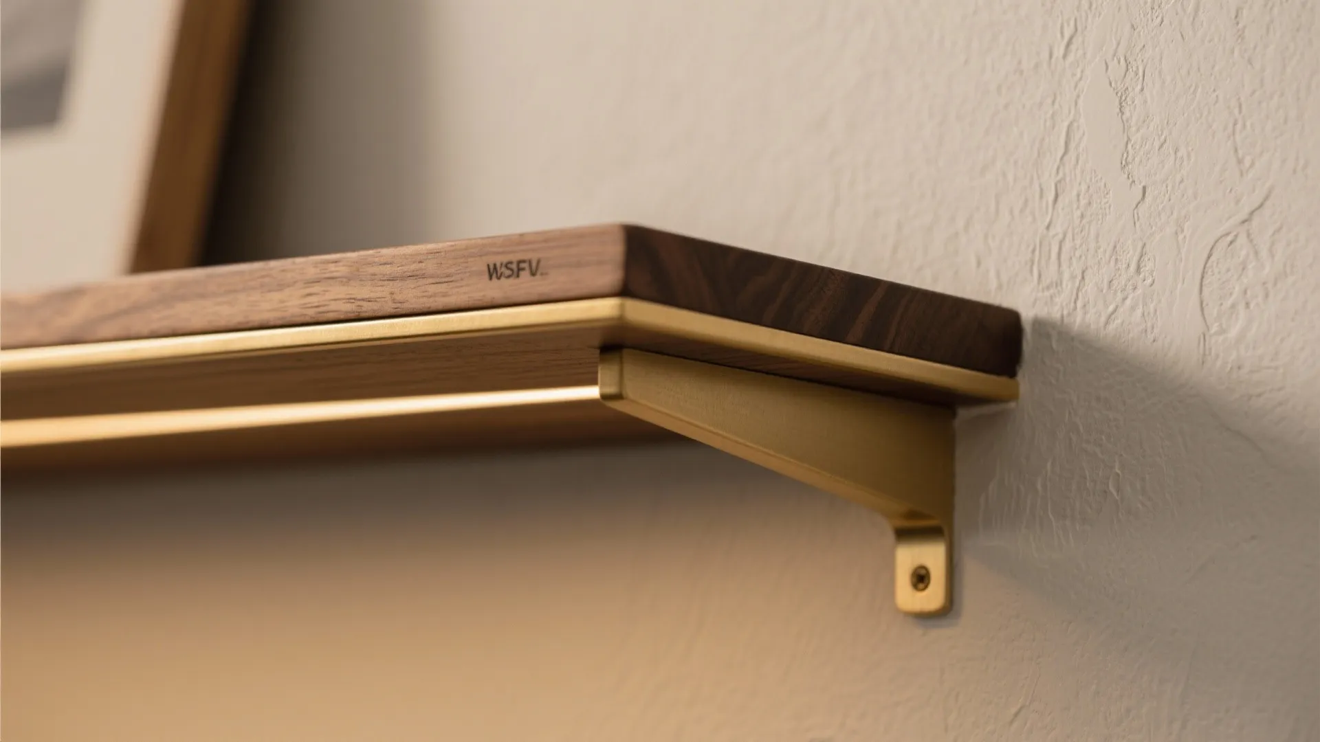 Close up of a wooden wall shelf with golden metal support and built-in led light