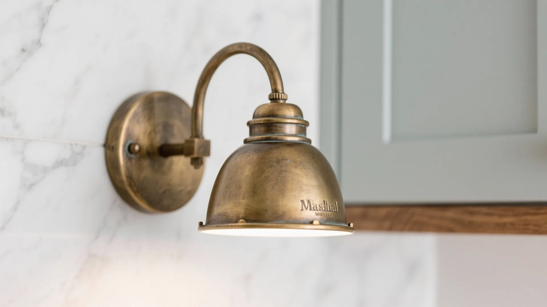 Brass and Aged Finishes to Warm Up Cool Palettes