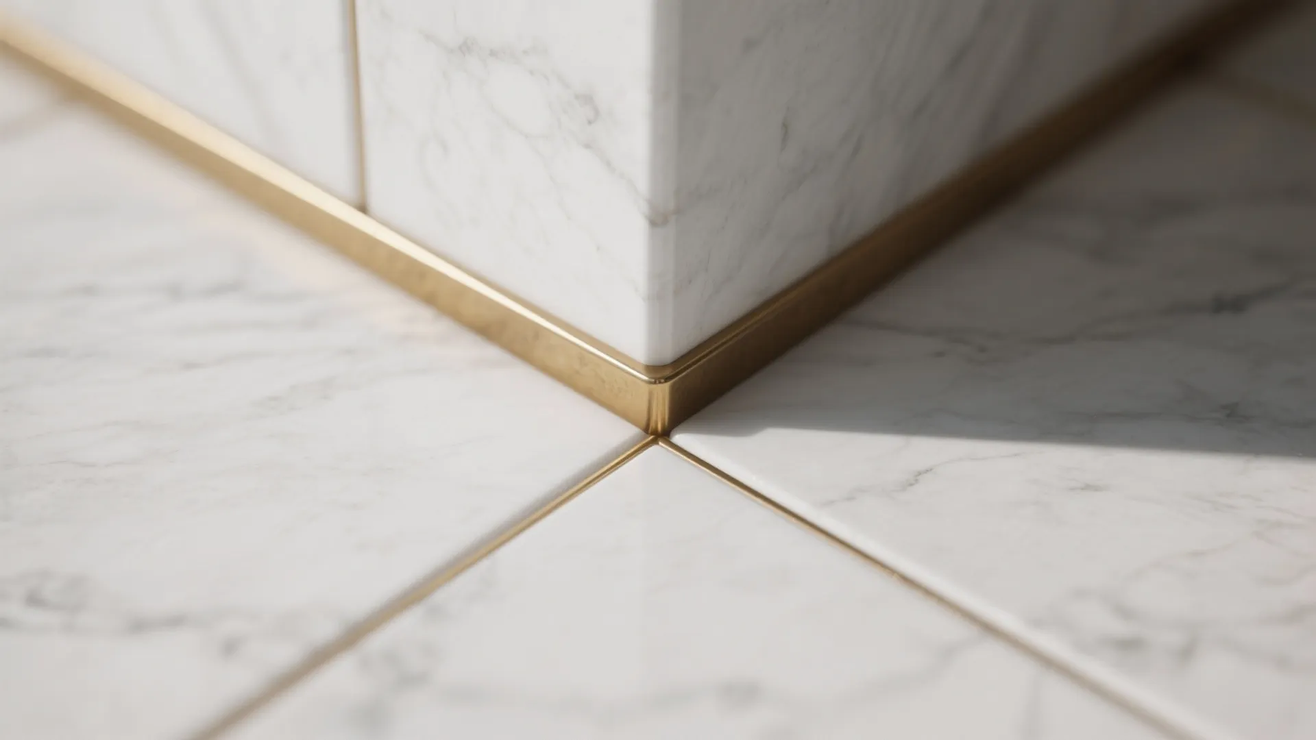 1) Minimalist marble field tile with warm brass accents