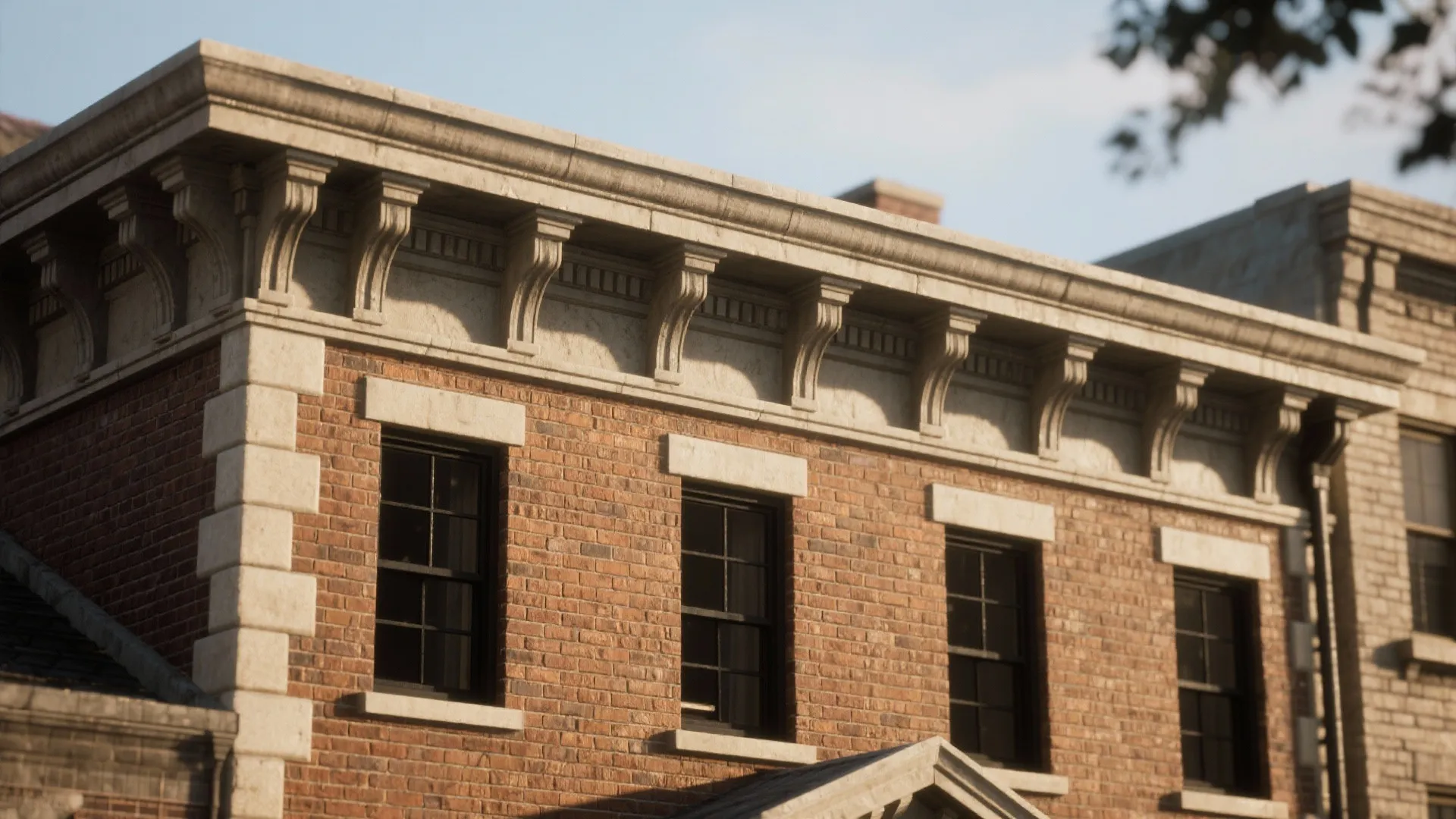 Red brick building showing dark windows and white decorative stone detail along the flat roof