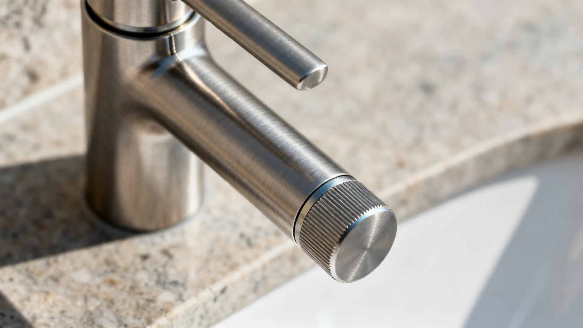 Close-up of modern bridge faucet seam and brushed finish with crisp craftsmanship.