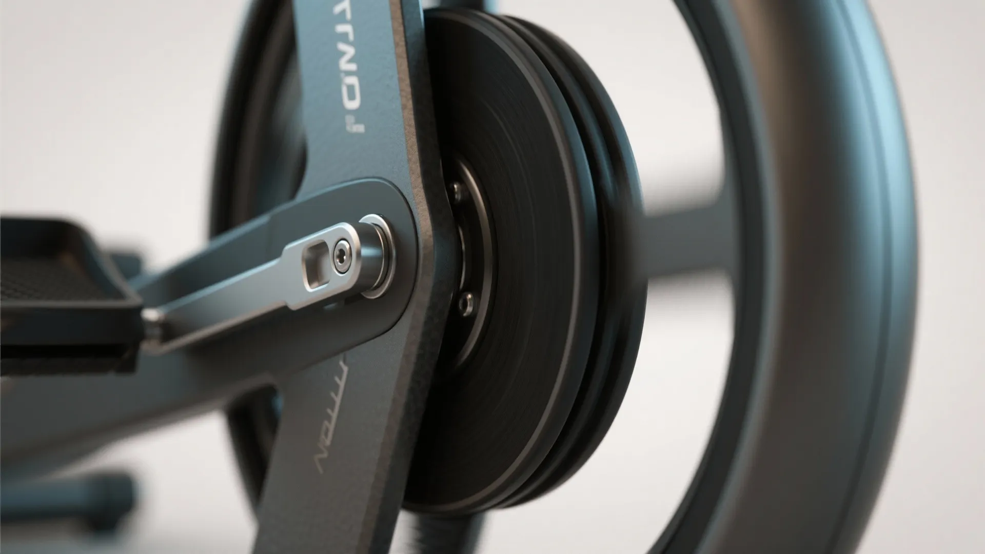 Close up view of a black metal wheel and pedal on a modern fitness machine