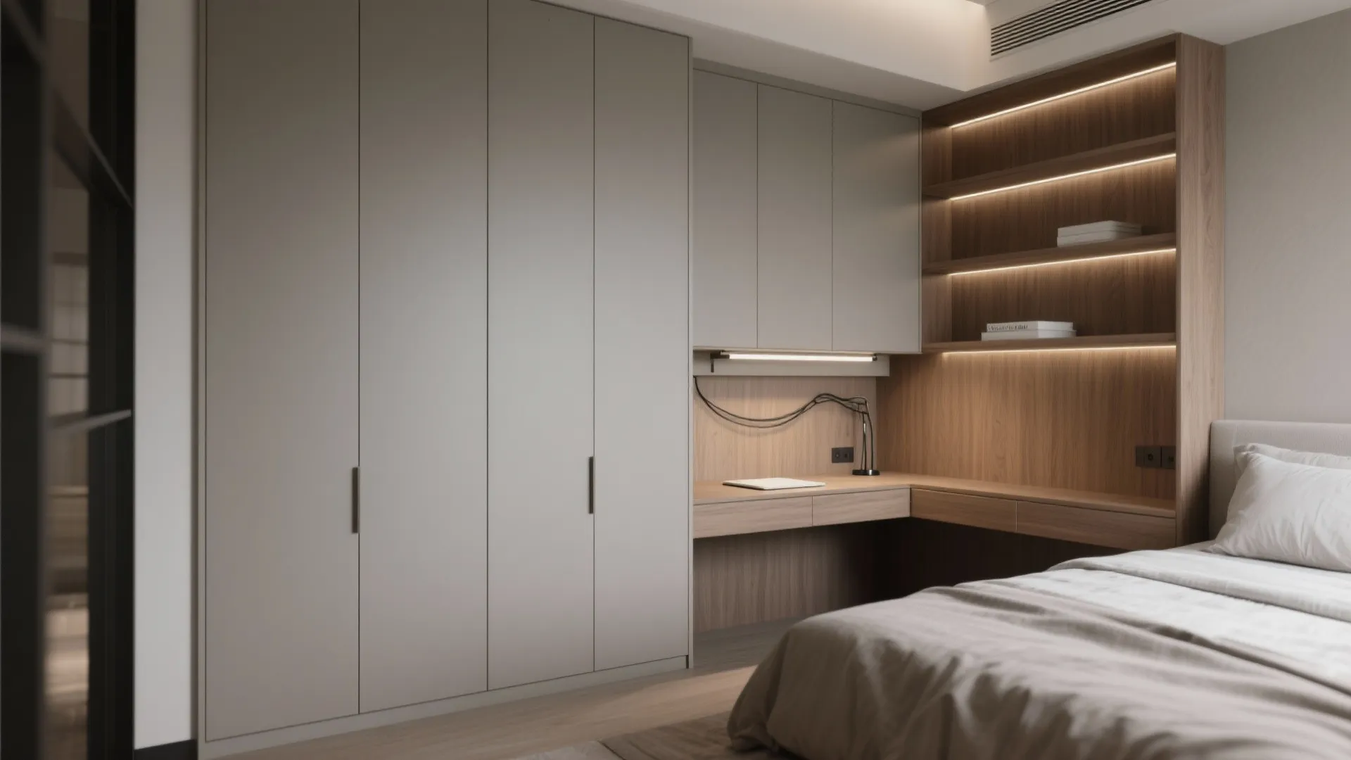 Custom built-in grey wardrobe and wooden desk area with integrated shelving and warm LED lighting