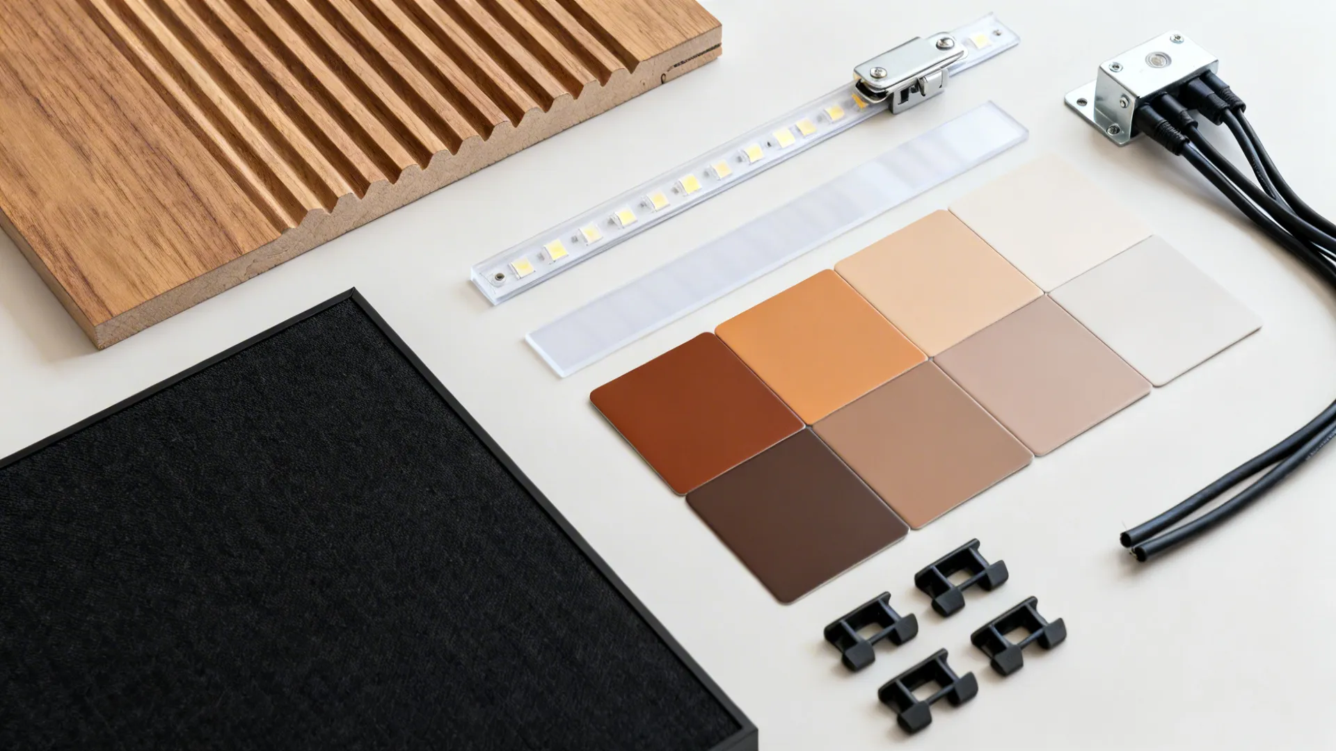 Material flat lay with fluted oak veneer, neutral lacquer swatches, LED diffuser, and hardware.