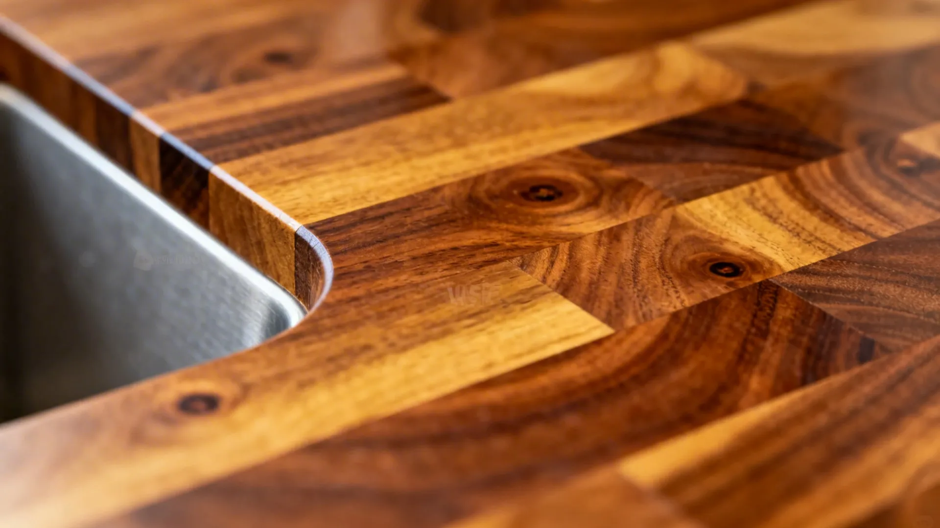 Macro of walnut butcher block with oiled finish and eased edge detail.