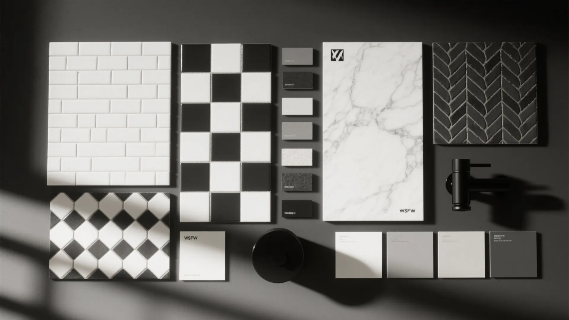 Top-down flat lay of monochrome bathroom materials, grout swatches, mosaics, and fixtures