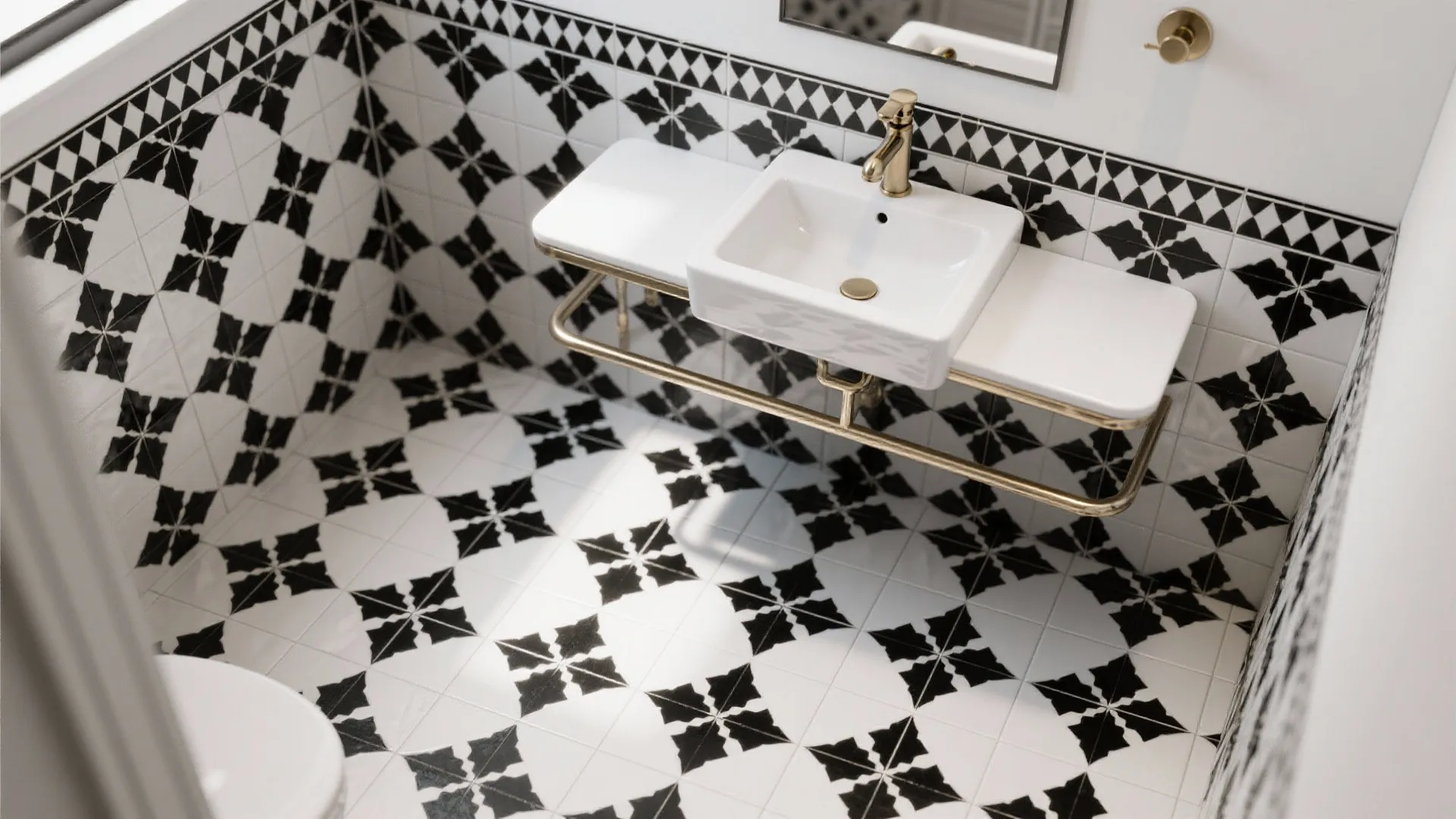 Top-down view of a black-and-white Moroccan floor pattern with a minimal console sink and wall-mount faucet.