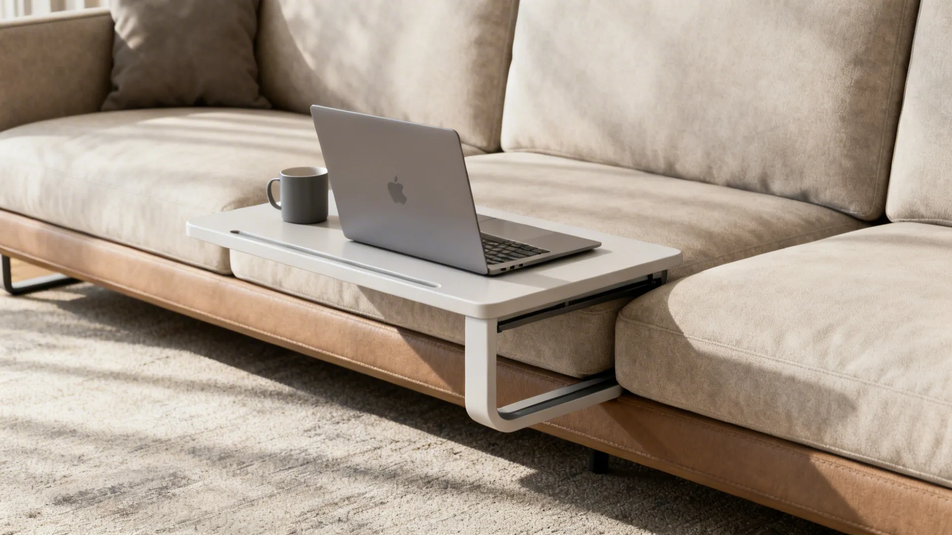C-shaped pull-up table slid under a sofa with a laptop and mug, showing ergonomic placement.