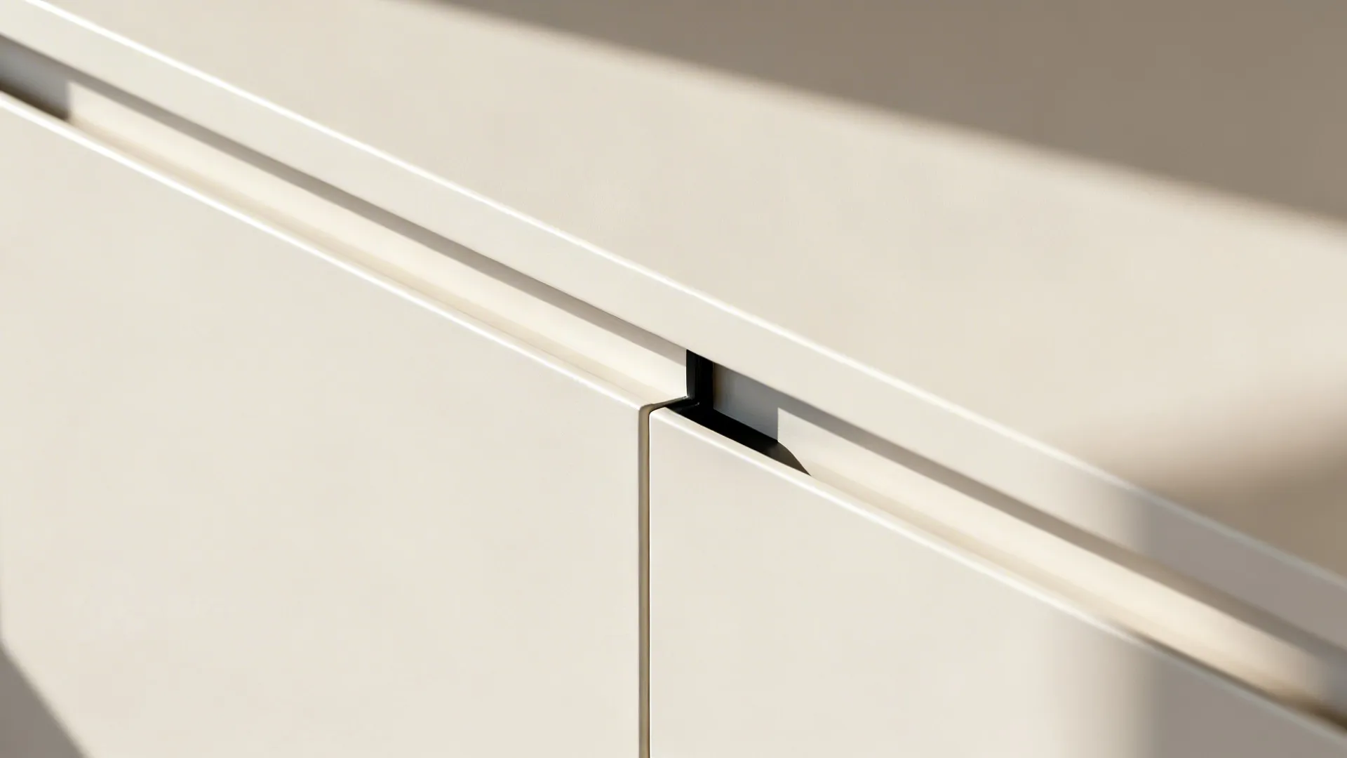 Close-up view of white cabinet doors with simple handles showing modern kitchen furniture design details