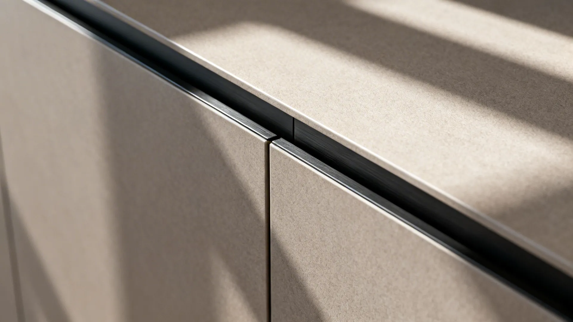 Macro view of matte handleless cabinet edge with precise reveal and push-to-open hardware.