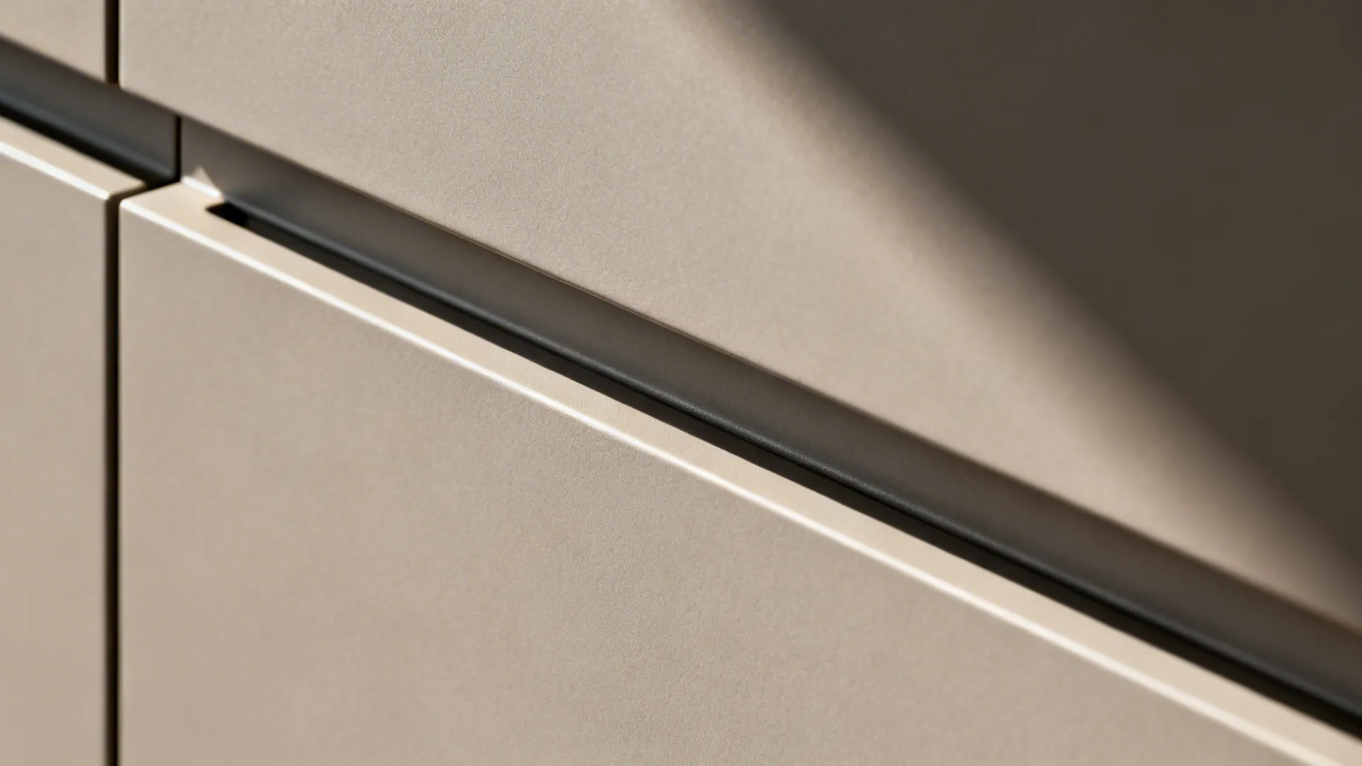 Macro of matte cabinet surface and concealed handle rail