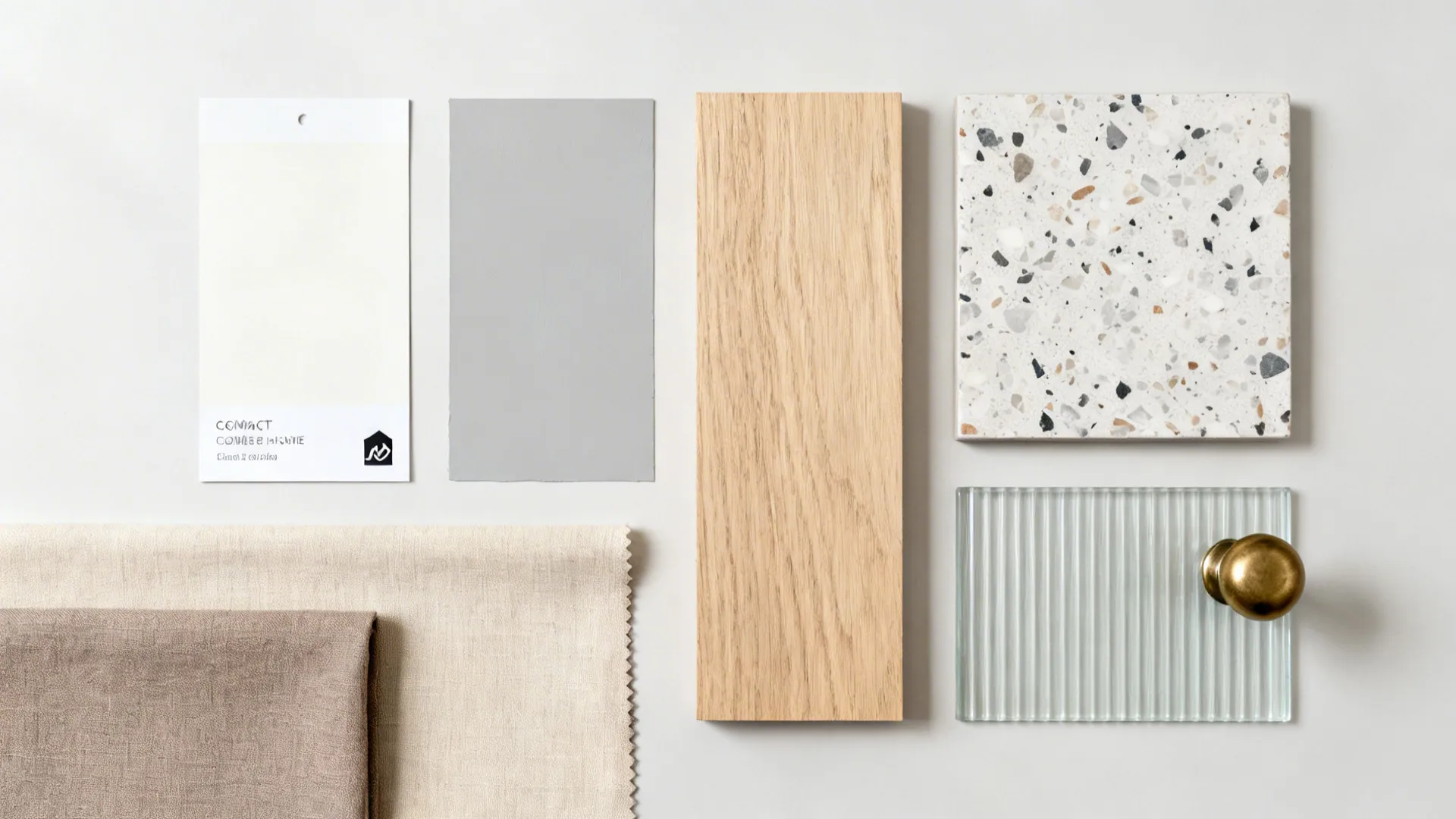 Interior design material board with wood tile fabric paint swatches and a small glass piece