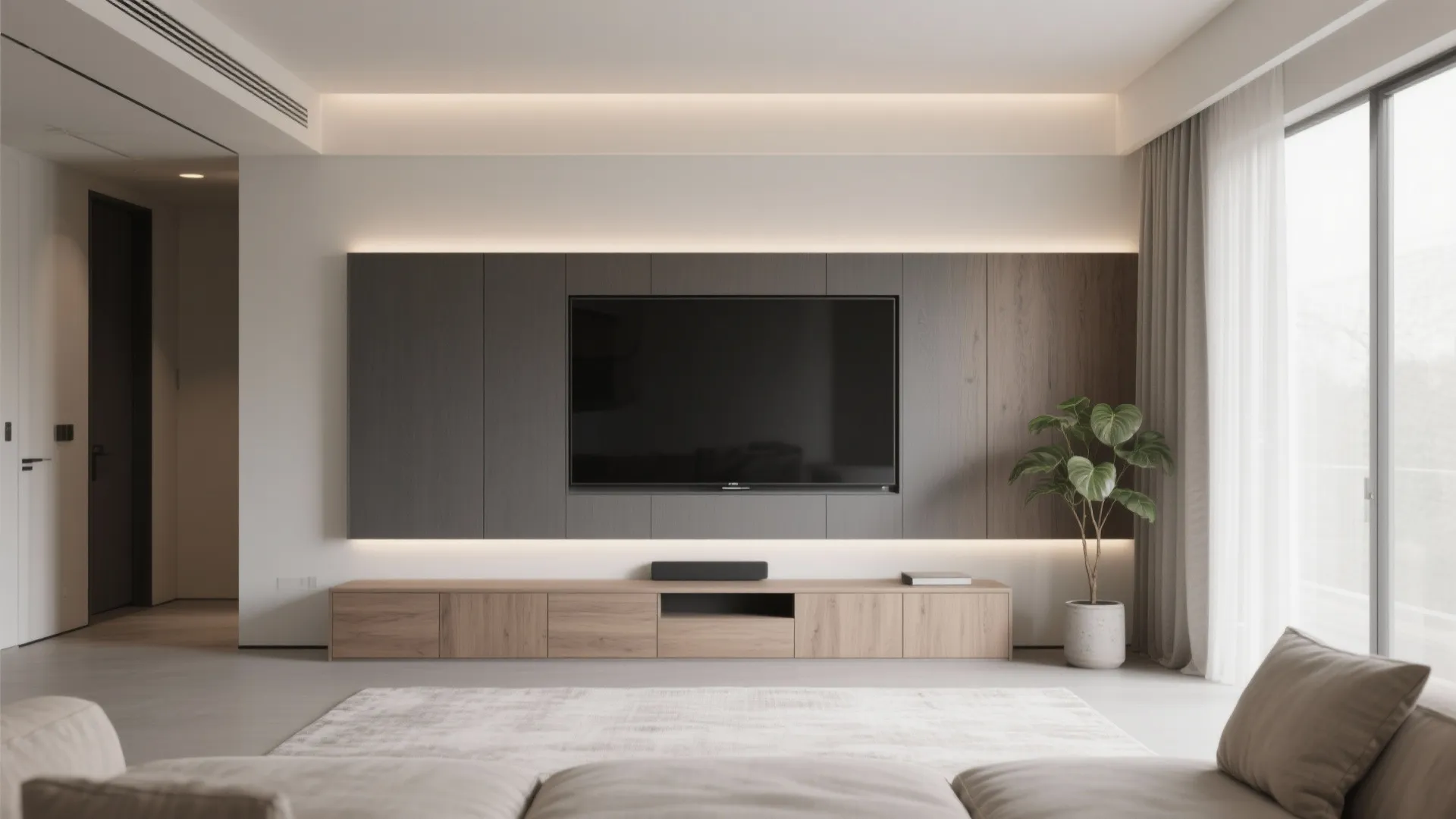 Modern living room with wall mounted television on wood panel and minimalist low storage cabinet