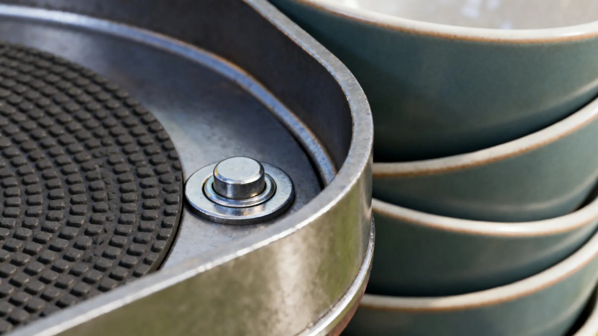 Macro detail of a corner carousel with a textured liner and smooth rotation hardware beneath stacked bowls.