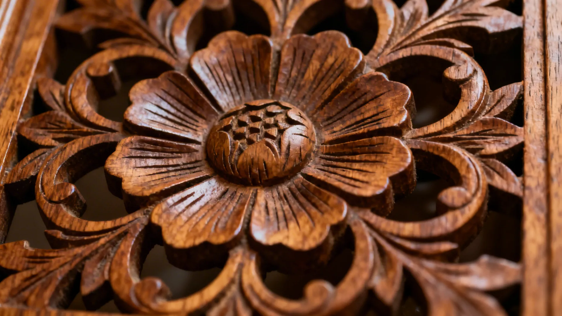 Close-up of a hand-carved wooden lattice panel with oiled finish and gentle shadowed relief.