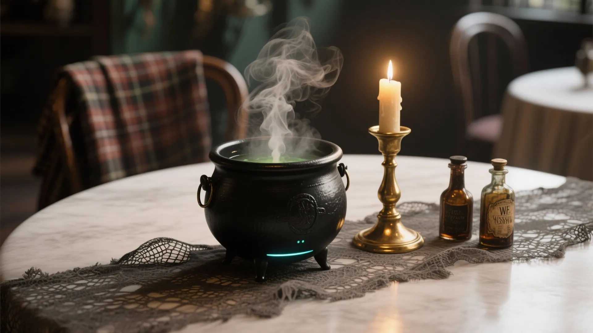 Small black cauldron with smoke next to a burning candle and glass bottles on table