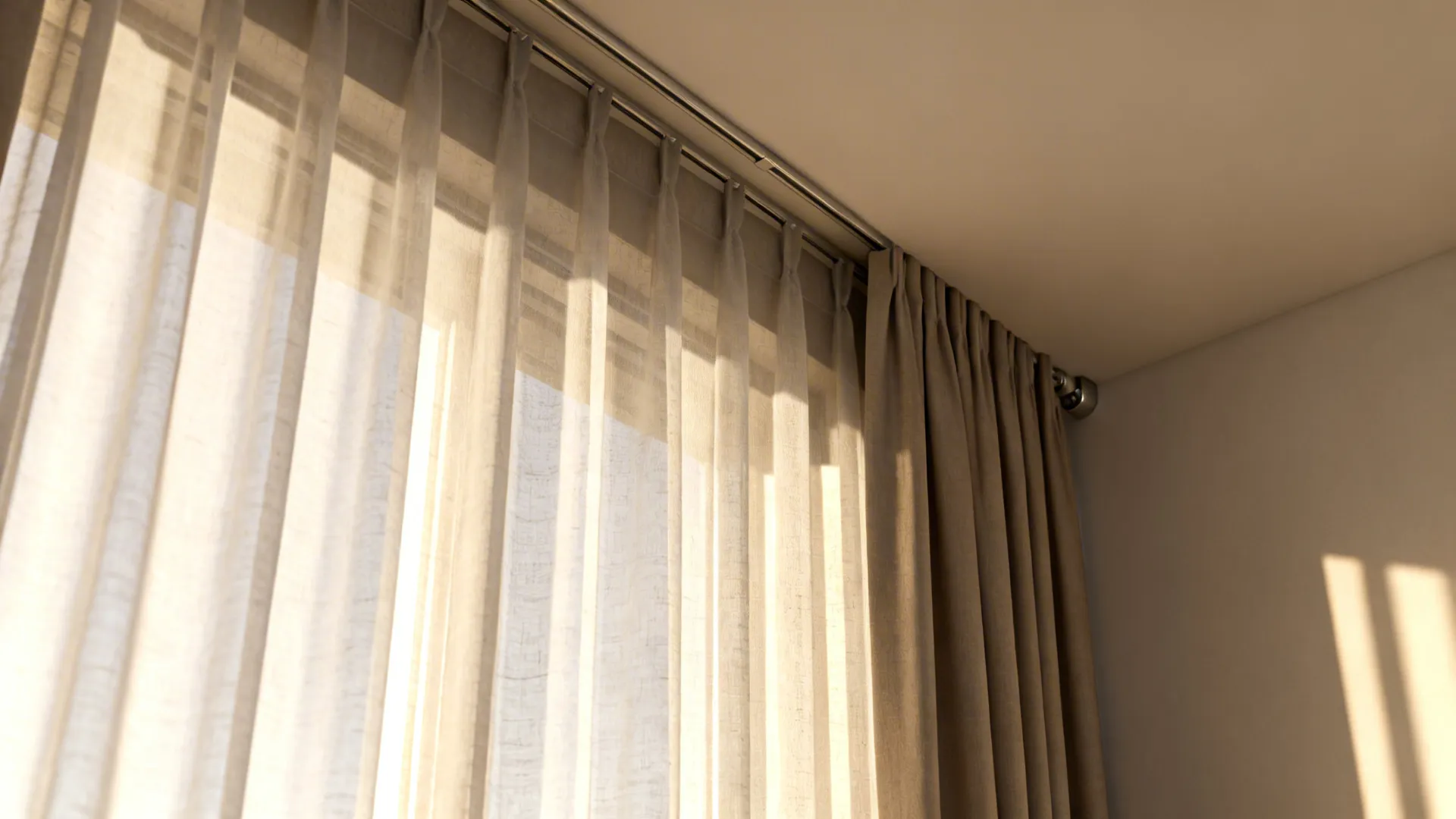 Sheer curtains hung to the ceiling with a blackout layer on one track, soft daylight filtering in.