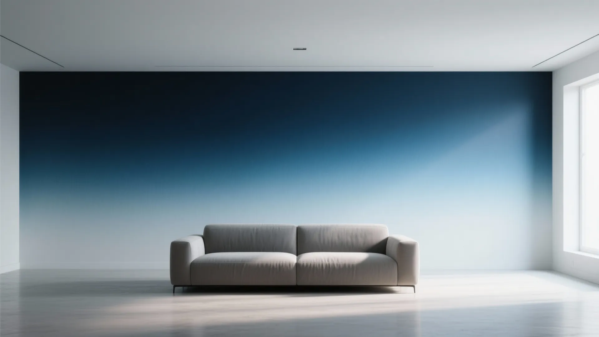 Modern living room featuring a grey sofa against a dark blue to light blue wall