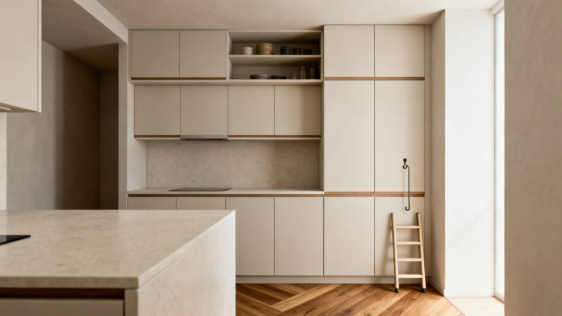 Ceiling-height matte upper cabinets with a slim ladder in a compact kitchen.
