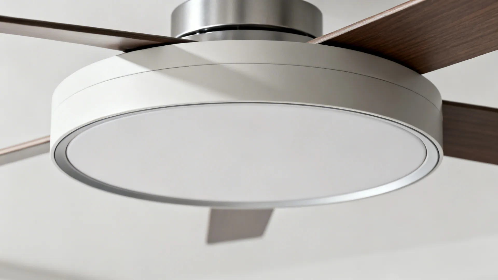 Close-up of a powder-coated ceiling ring with a precise reveal around the fan canopy.
