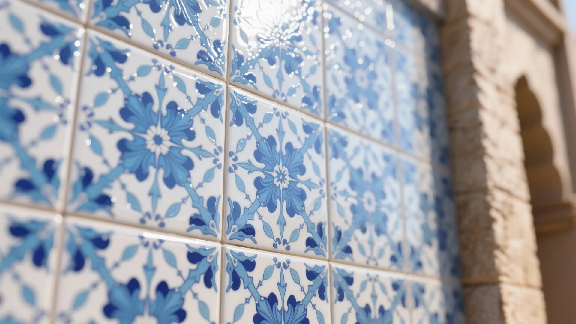 Close up view of blue and white floral pattern ceramic tiles on an outdoor stone wall
