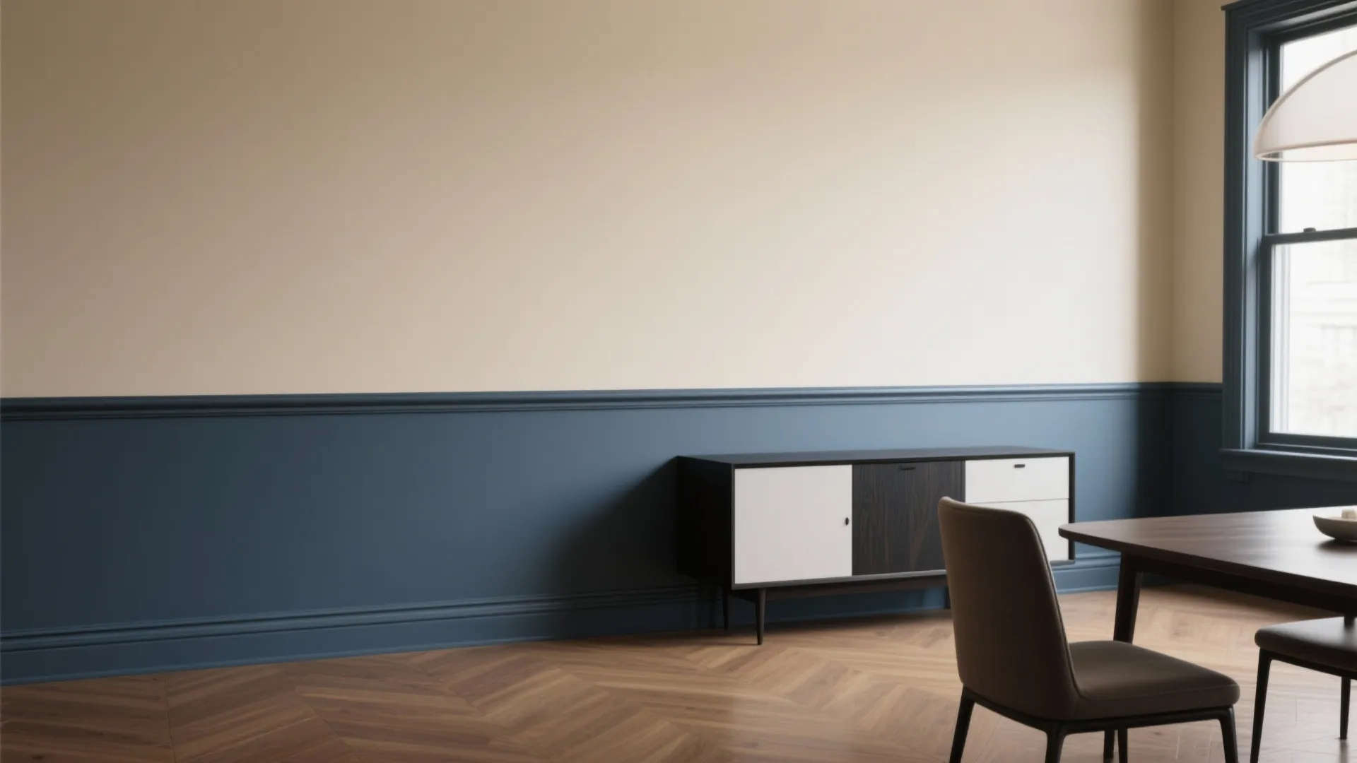 Modern dining room featuring blue wall panel with cream top plus cabinet and wooden floor