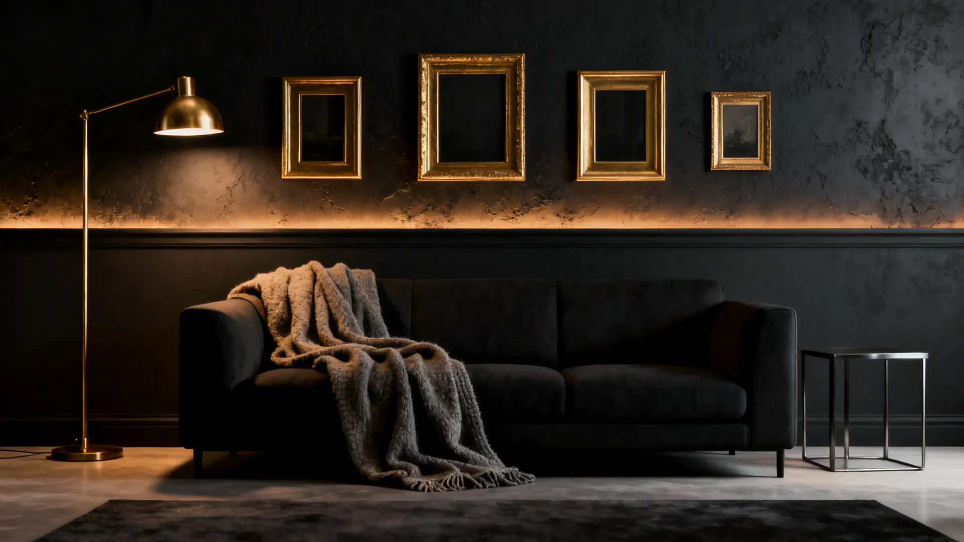 Focal charcoal wall behind a sofa with gold accents and warm layered textures