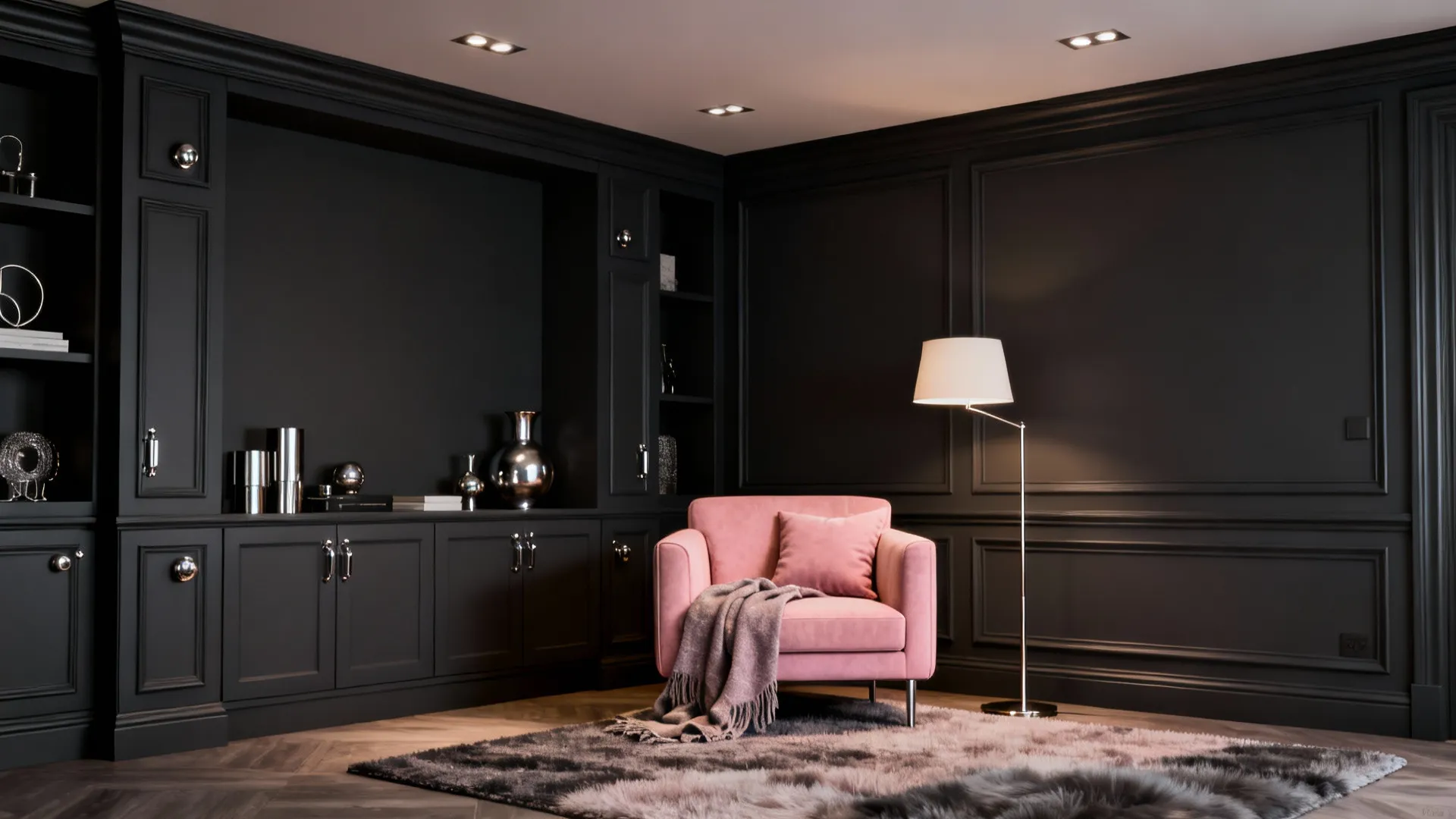Charcoal built-ins with blush pink seating and metallic accents in a small living area.