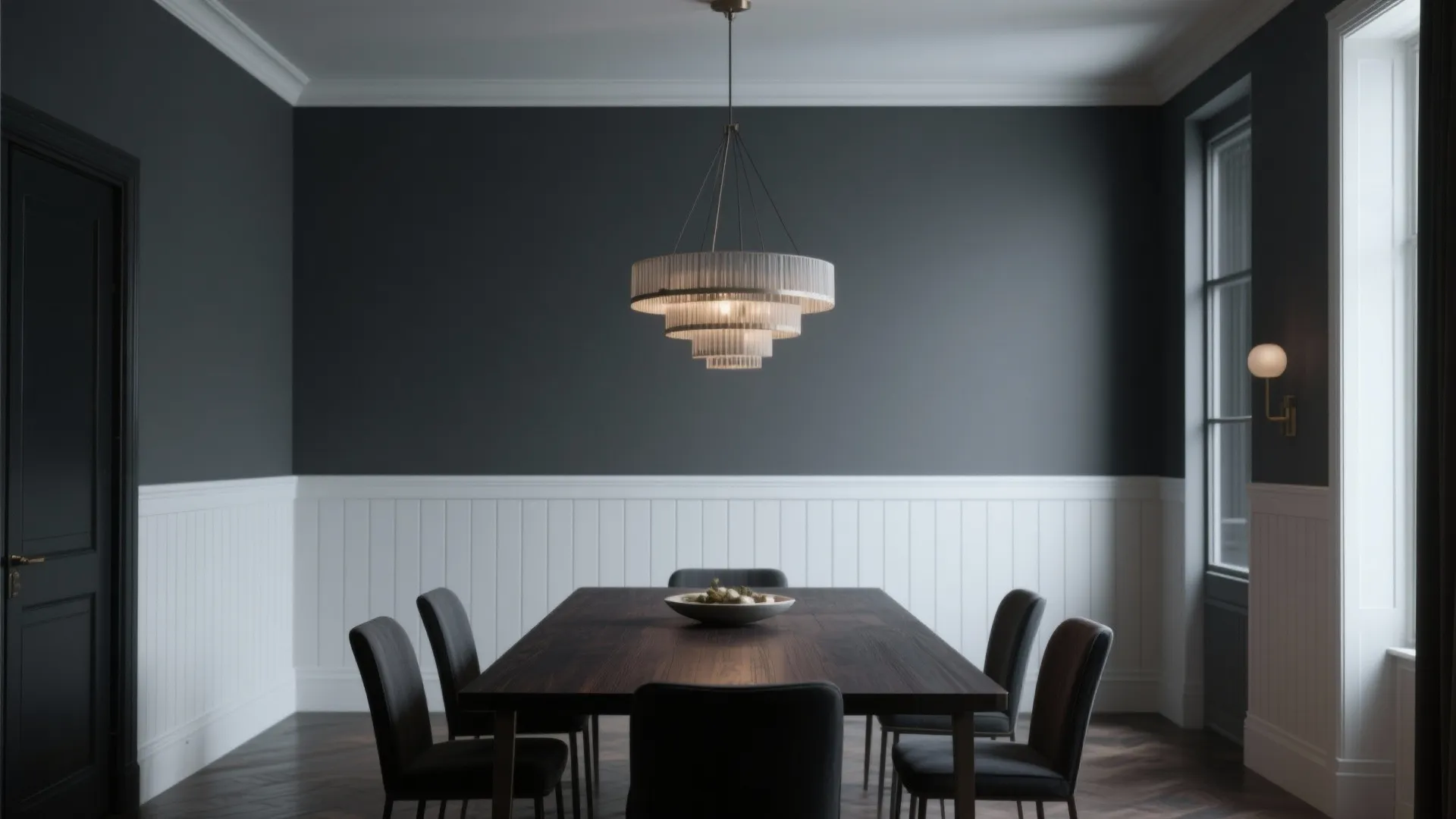 Elegant dining room with dark charcoal walls white wall panels large table and ceiling light