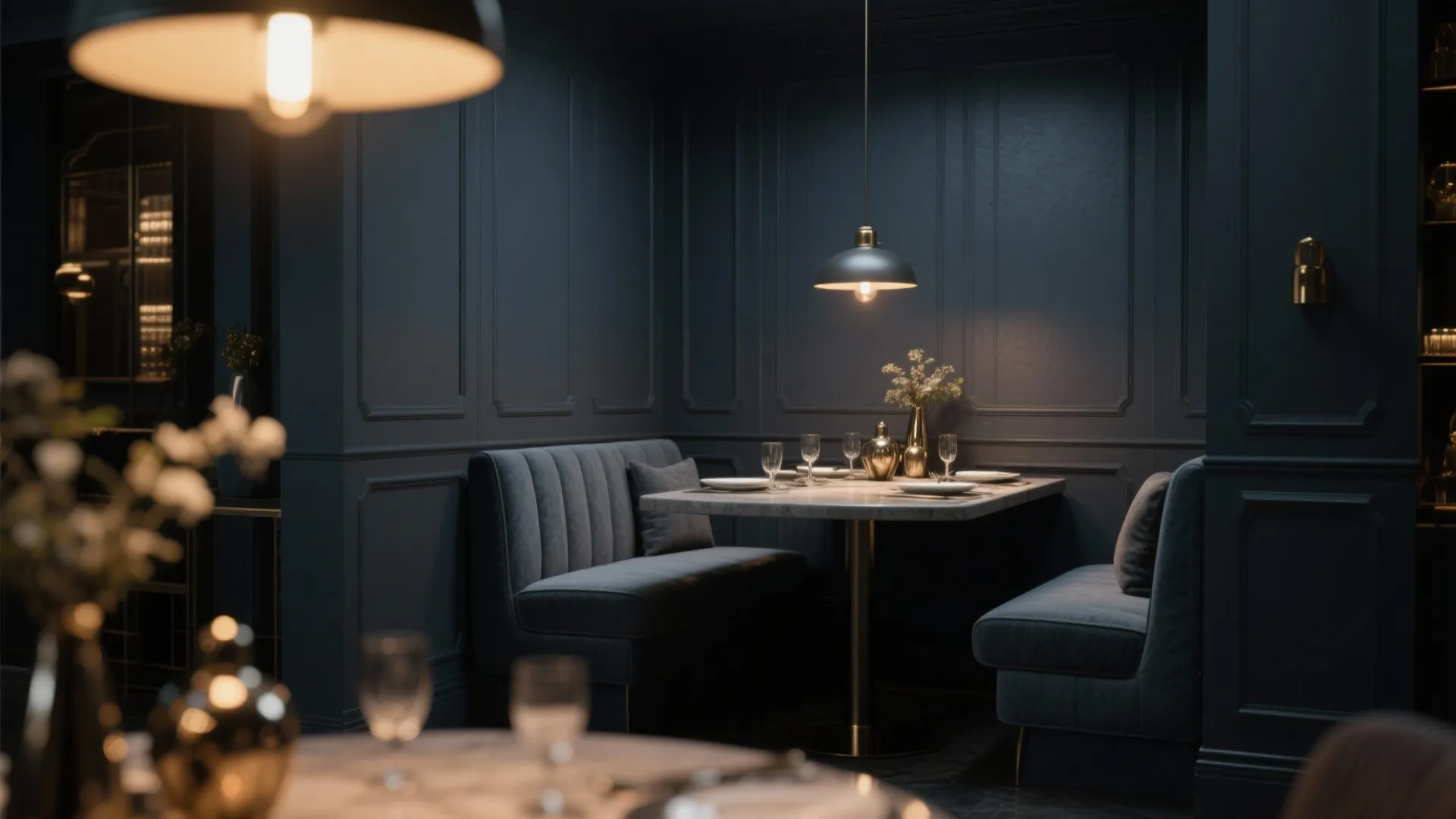 Dark charcoal dining nook with blue wall panels marble table comfortable sofa seating and ceiling light