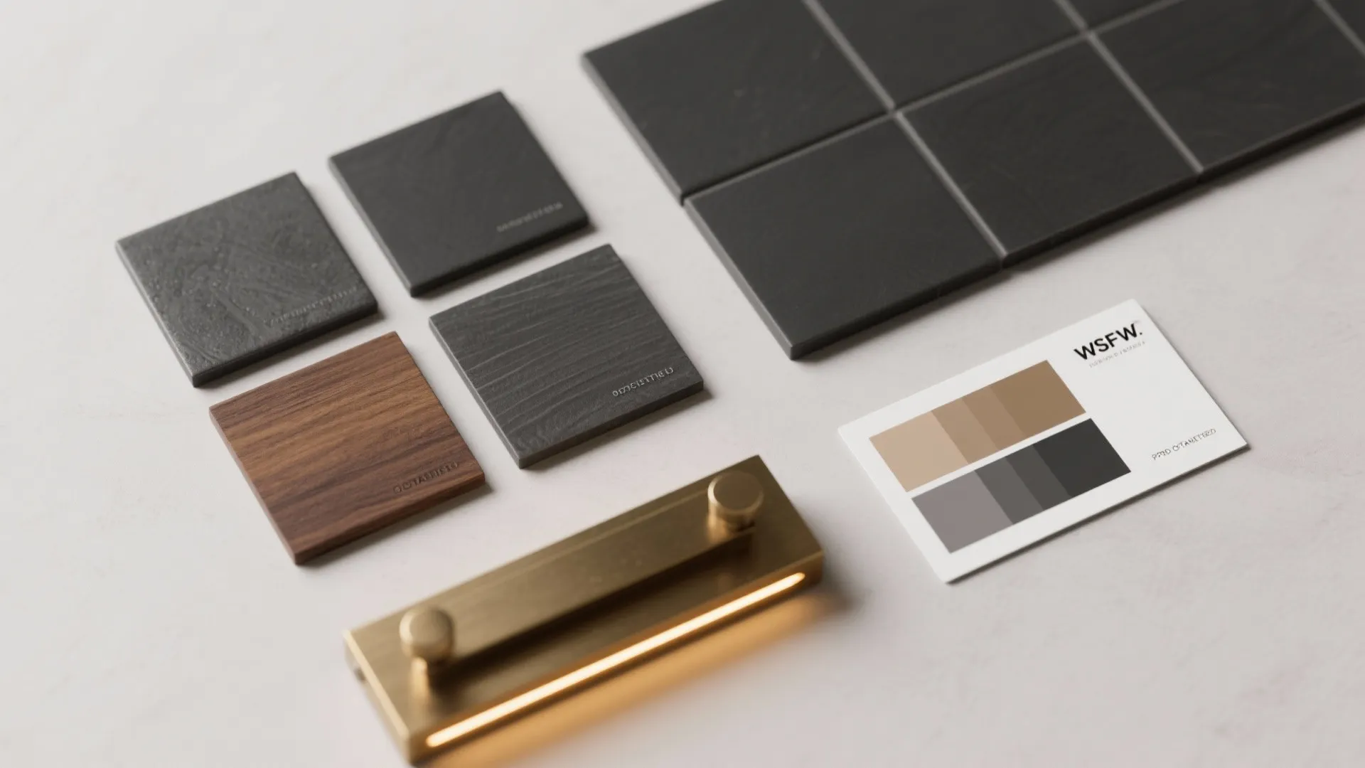 Interior design material board with wood samples dark tiles gold light fixture and color card