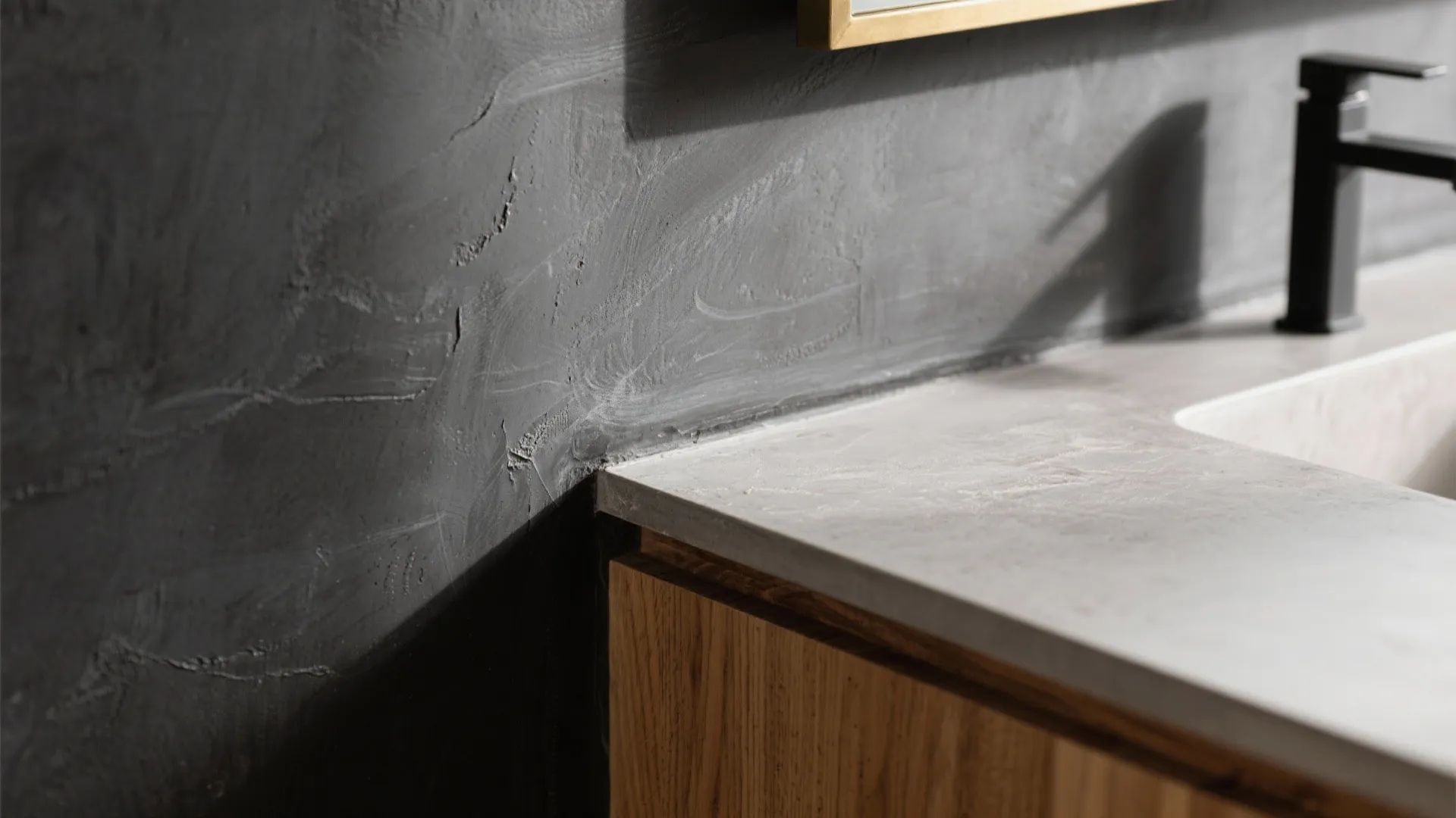 Charcoal Plaster, Microcement, and Wood for Warmth