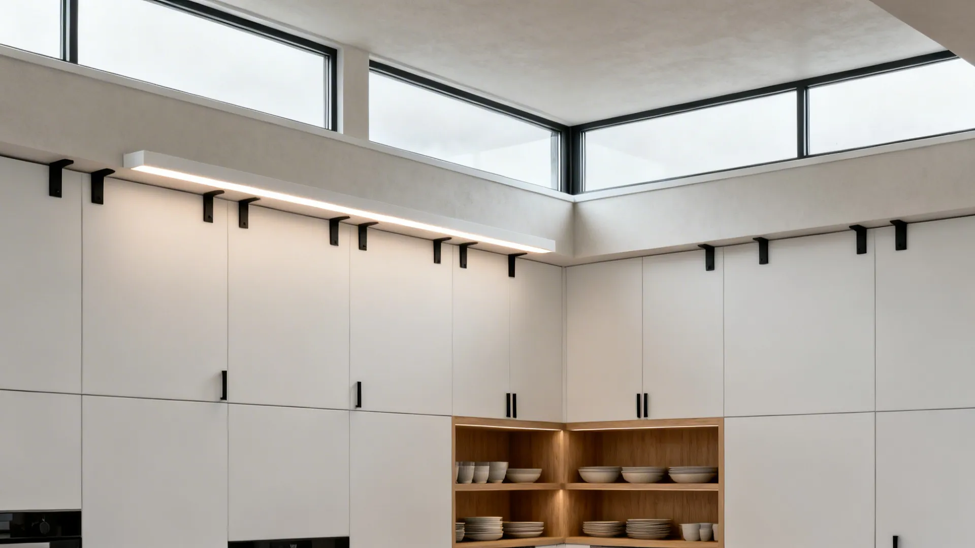 Small kitchen with high clerestory corner windows and open shelves below.
