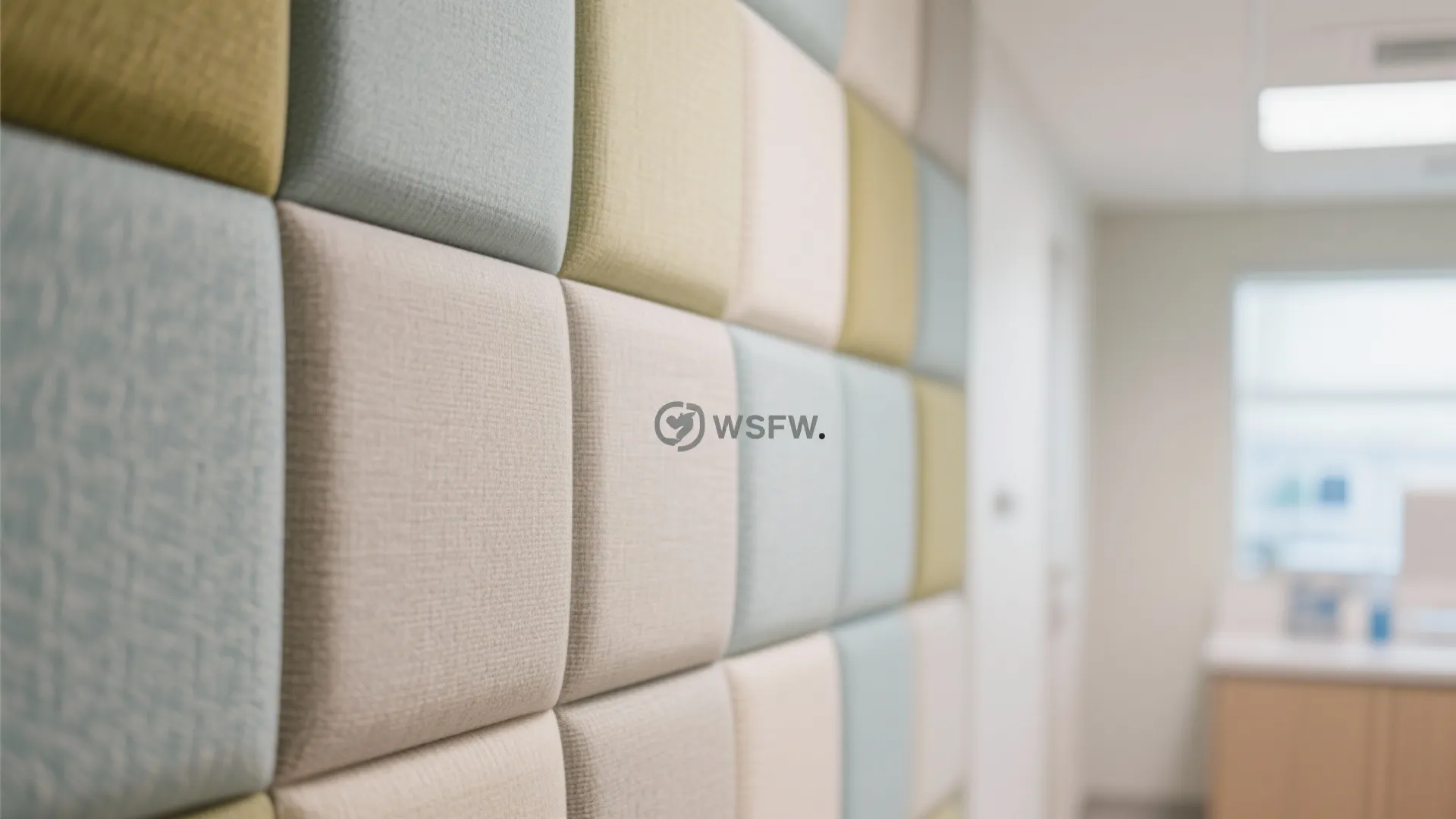 Colorful square wall panels in light blue and beige create a soft texture in a room