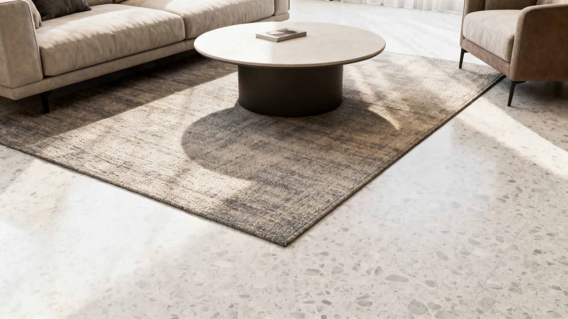 Small living room with a rug placed only under the coffee table to ground the area without covering the floor