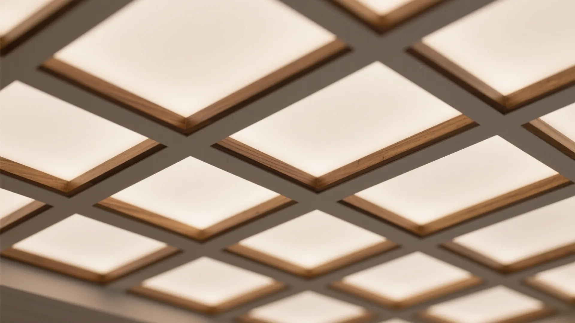 Close up view of a ceiling with rectangular wood framed recessed light panels for illumination