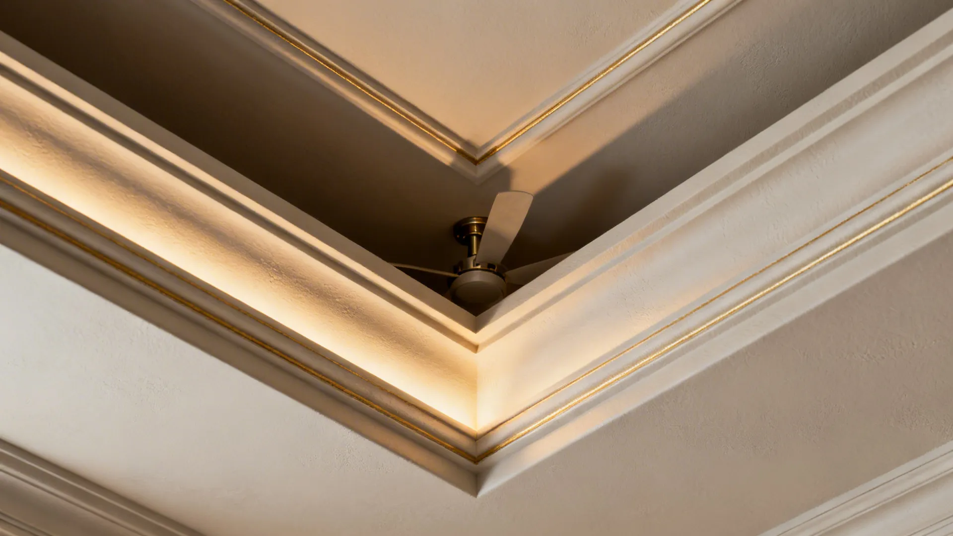 Close-up of coffered ceiling tier with precise edges and aligned fan canopy.