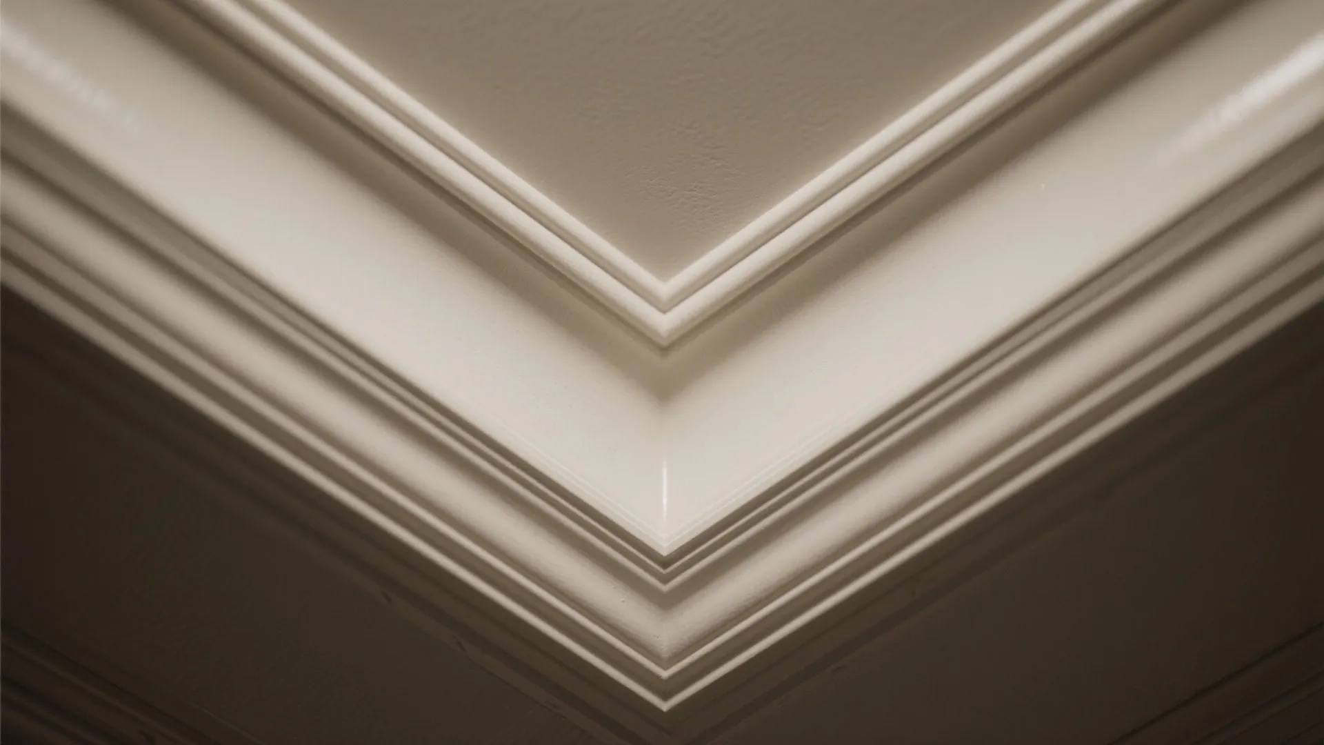 Macro of a shallow coffer intersection with crisp edges and satin finish.