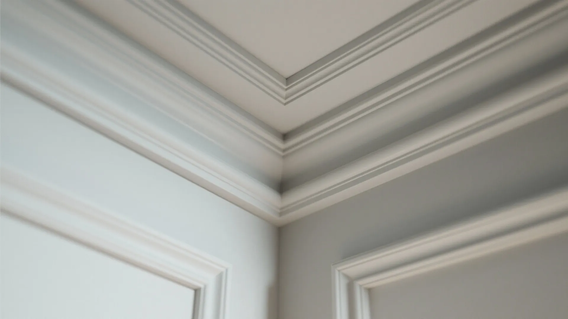 Classic white wall panel and ceiling decorative trim detail in a clean modern room corner