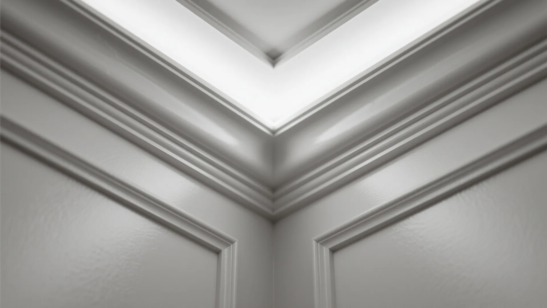 Close up view of white wall panel design with light fixture hidden in the ceiling