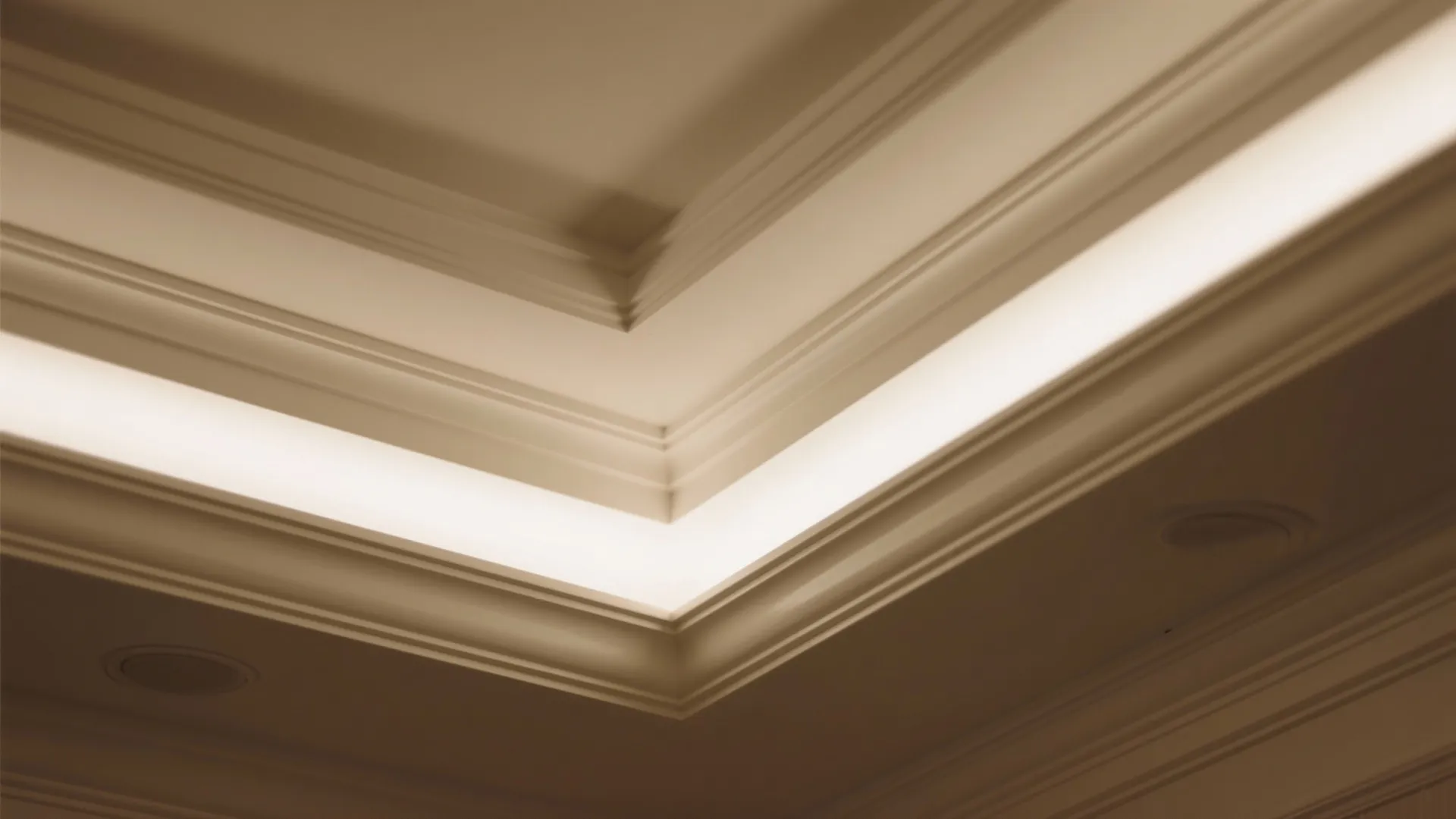 Close up view of white ceiling wall panels with warm hidden light strips for home decoration