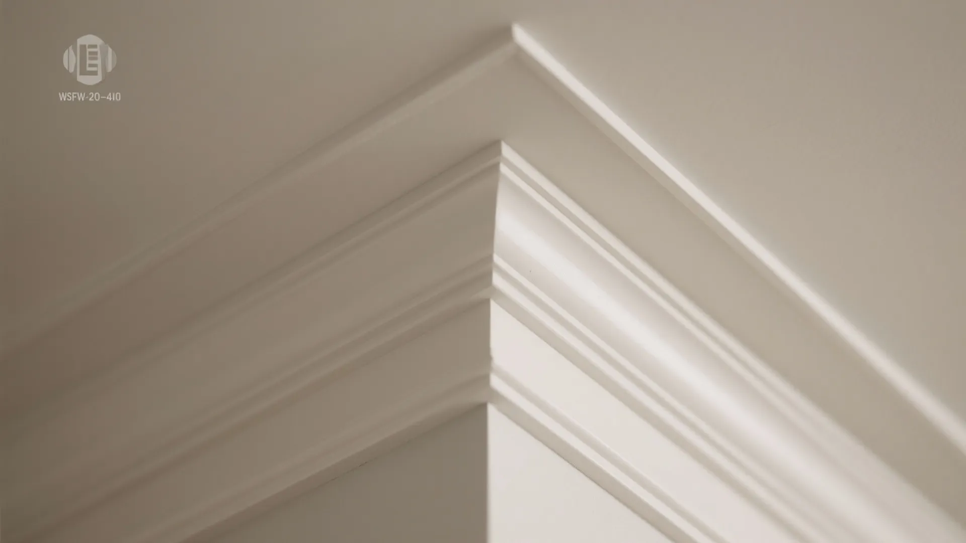 Close up view of white crown wall panel molding detail on a clean white ceiling